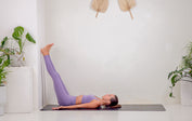 Legs up the wall on a grey Liforme Yoga mat