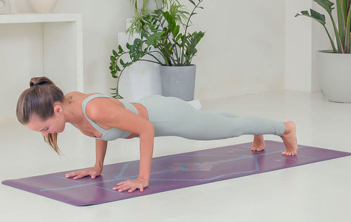 Woman doing Chaturanga Dandasana (Four Limbed Staff Pose)