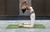 Camel Pose on a Green Liforme Yoga mat to open the Throat Chakra