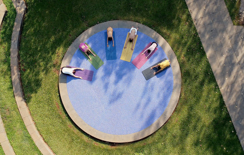 Group in child's pose on Liforme Yoga mats