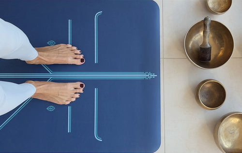 Mountain pose foot detail on a blue Liforme Yoga Mat