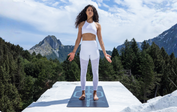 Woman in Mountain Pose on a Black Liforme Yoga Mat