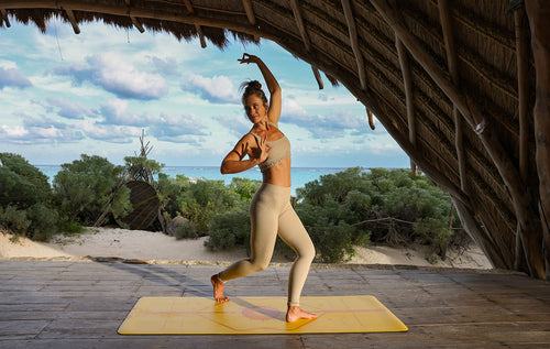 Shiva Squat on a Yellow Liforme Yoga Mat