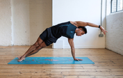 Man in Side Plank on an Aqua Liforme Yoga mat for Tennis players