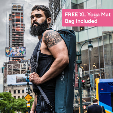 Man holding a Liforme yoga mat bag in an urban setting with text about a free XL yoga mat bag offer.