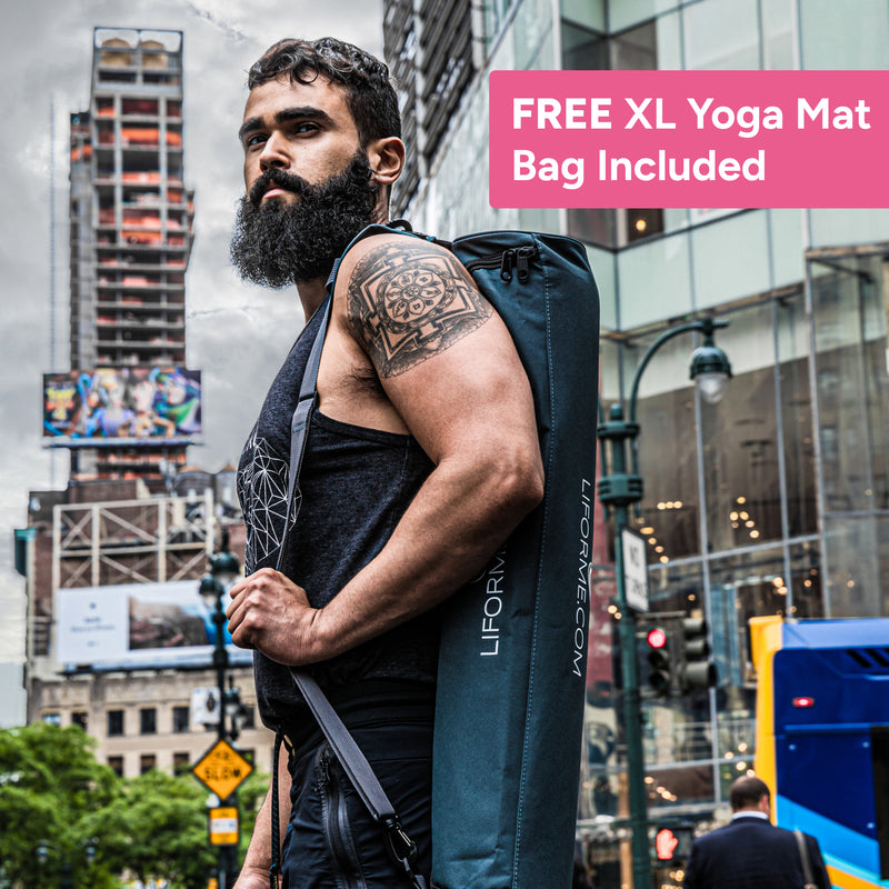 Man holding a Liforme yoga mat bag in an urban setting with text about a free XL yoga mat bag offer.