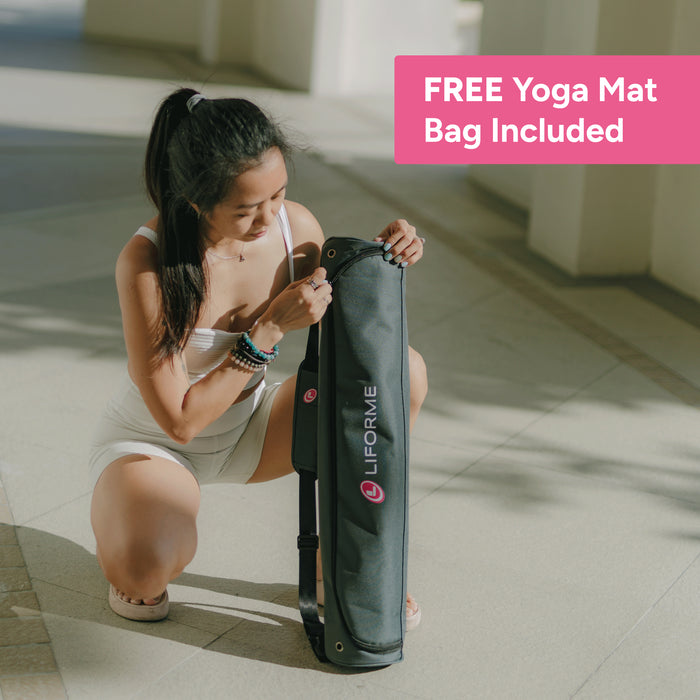 Woman holding a liforme yoga mat bag, demonstrating the free yoga mat bag you get with every mat purchase. 