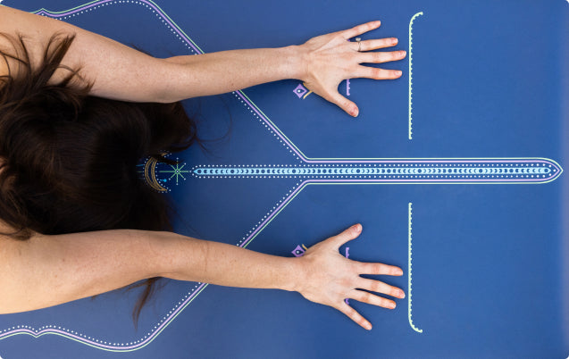 Full-length view of the Liforme Cosmic Moon Yoga Mat in Dusk Blue, showcasing the smooth yet grippy CleanGrip surface and its vibrant lunar-inspired alignment.