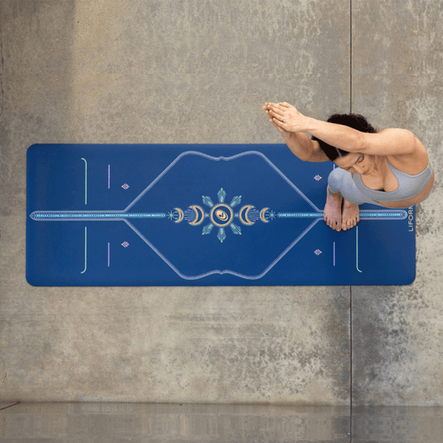 Yogi practicing on a Liforme yoga mat with non-slip GripForMe surface on concrete.