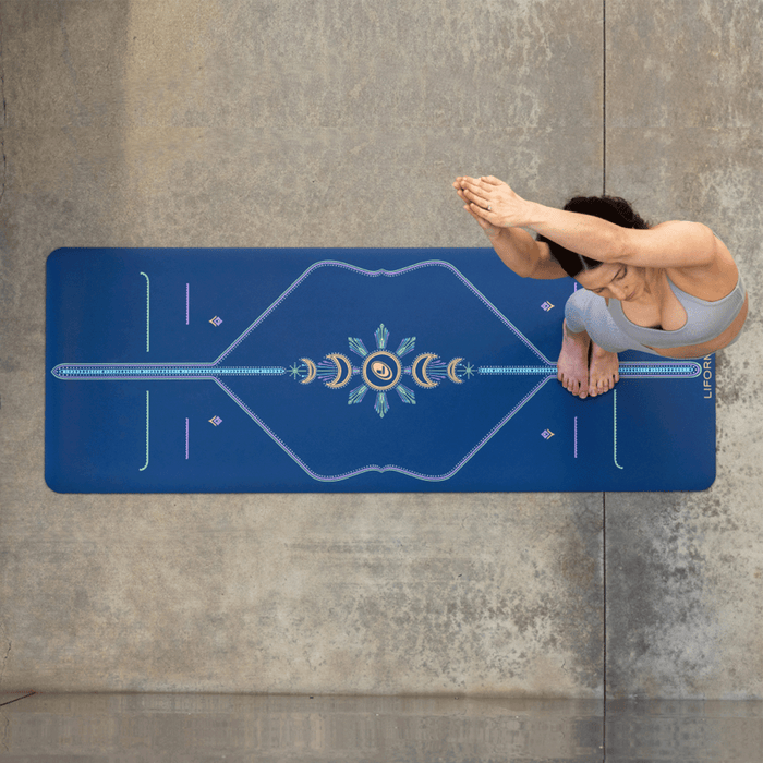 Yogi practicing on a Liforme yoga mat with non-slip GripForMe surface on concrete.