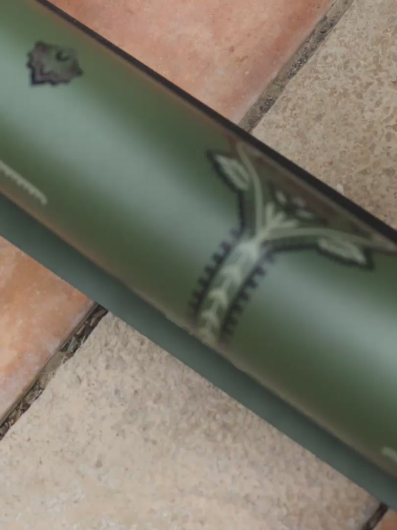 A woman practicing yoga on a Liforme Deep Forest Mindful Garden Yoga Mat 