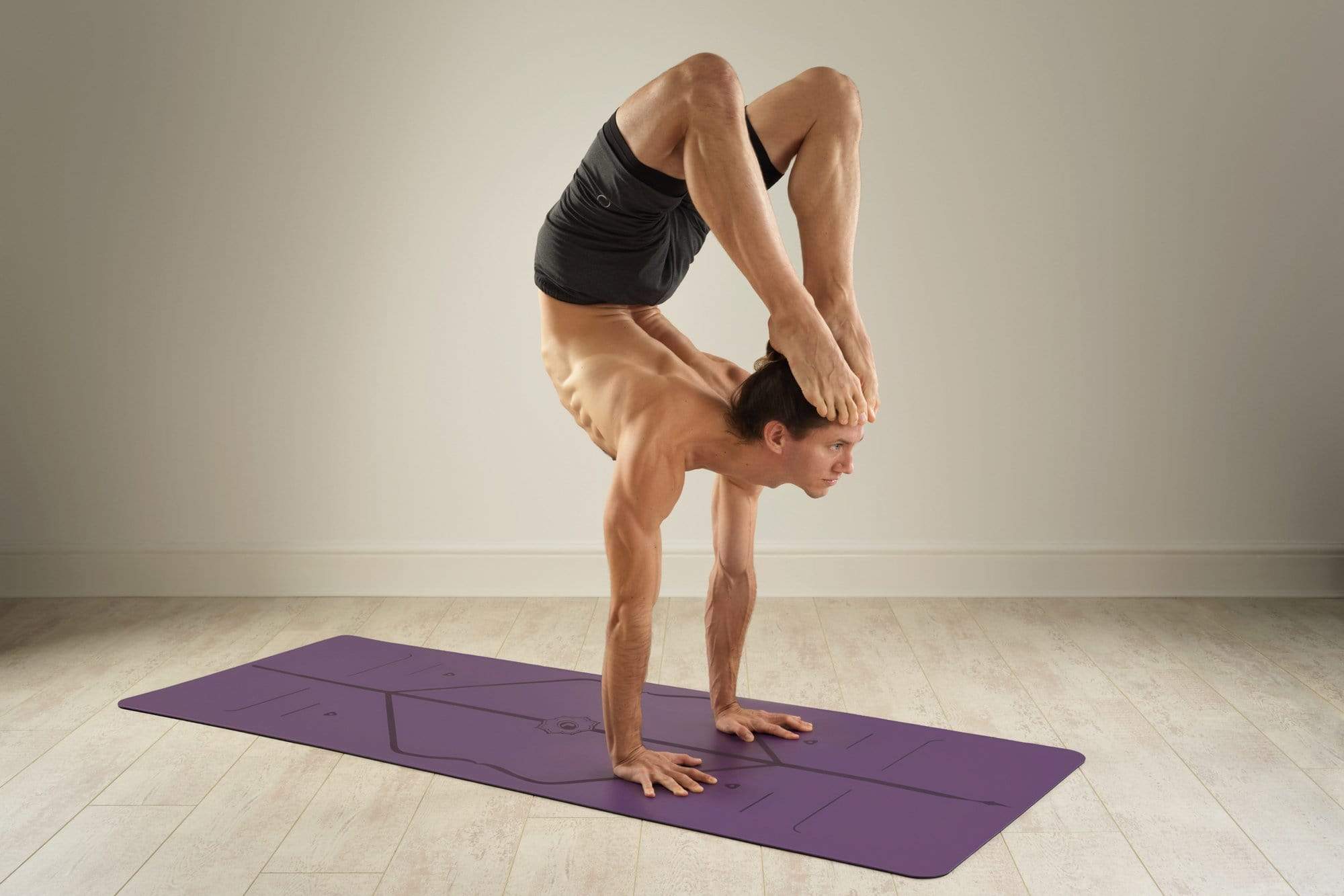 Yogi using Liforme Purple Earth Yoga Mat for extra grip